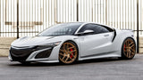White Acura NSX with gold wheels